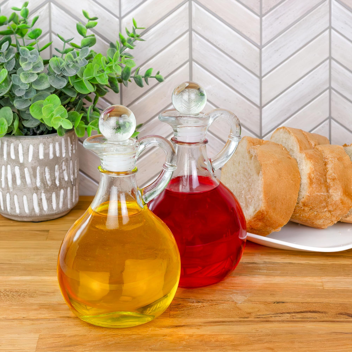 Cornucopia Brands Glass Oil and Vinegar Cruets (Set of 2); 8oz Round Oil Dispensers / Salad Dressing Bottles with Stoppers
