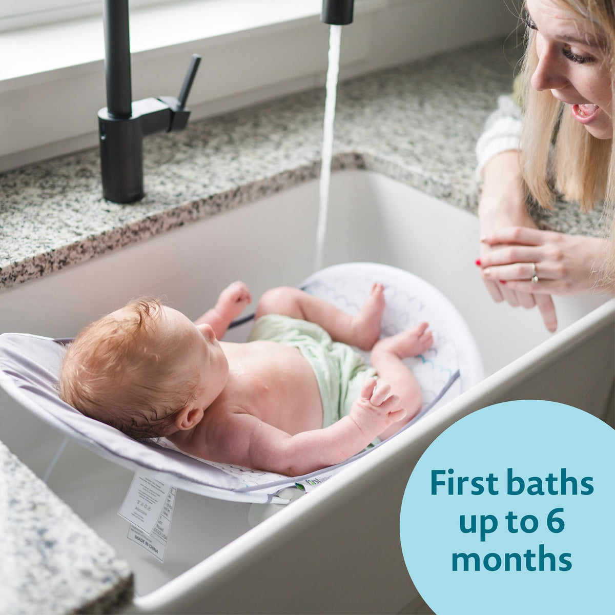 The First Years Sure Comfort Folding Baby Bather - Baby to Toddler Bath Tub - No-Slip Seat - for Sink or Tub Use