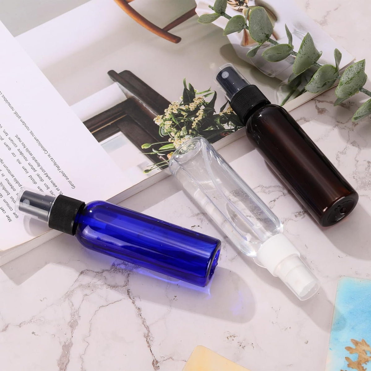 uxcell 100 Pack Spray Bottles, 2 Oz/60ML Reusable Clear Empty Mist Plastic Mini Travel Bottle Set,Small Refillable Liquid Containers for Household Use, Essential Oil(Blue Black)